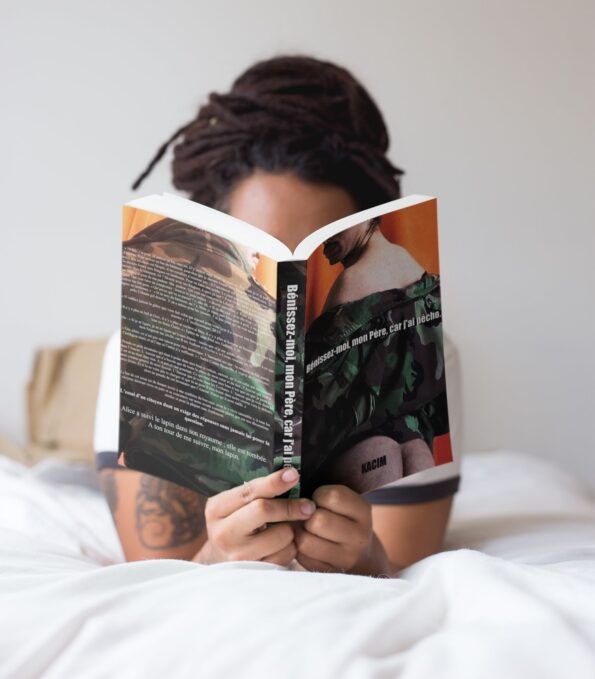 girl-with-dreadlocks-reading-a-book-mockup-while-in-bed-a17301